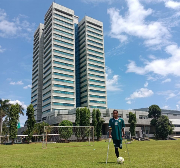 Passion for sports: Muhammad Lukiyono posed at a soccer field at Indonesia's Parliament Building. (Courtesy of INAF)