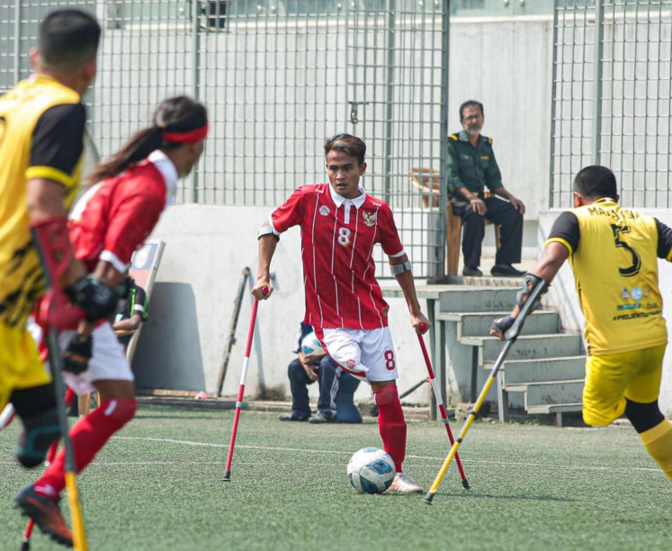 Unstoppable: Aditya shows his talent in a World Cup qualifying match against Malaysia. (Courtesy of INAF)
