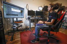 Gamer: Chris Robinson plays a video game in his apartment on March 26, in Justice, Illinois, the United States. 