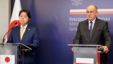 Japan's Foreign Minister Yoshimasa Hayashi (L) and his Polish counterpart Zbigniew Rau give a joint press conference in Warsaw on April 4, 2022. 