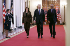 (L-R) Vice President Kamala Harris, former President Barack Obama, and US President Joe Biden arrive for an event to mark the 2010 passage of the Affordable Care Act in the East Room of the White House on April 5, 2022 in Washington, DC. 