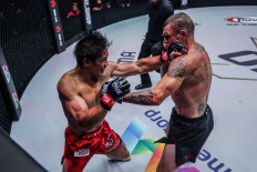 Eduard Folayang (left) trades strikes with Australian Muay Thai icon John Wayne Parr at a legend vs. legend battle in ONE X on March 26.