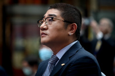 Xu Lei, retail chief executive officer of Chinese e-commerce giant JD.com, takes part in a ceremony to mark company's listing on the Hong Kong stock market, at JD.com's headquarters in Beijing on June 18, 2020.