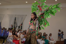 Catwalk power: Luana Melgueiro da Silva of the Amazon’s Baré tribe, presents a creation on Saturday during a fashion exhibition in Manaus, Amazonas state, Brazil. The exhibition is the country’s first to feature indigenous designers, stylists and models.