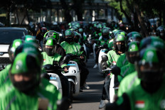Who stands to win or lose when Grab takes over Gojek