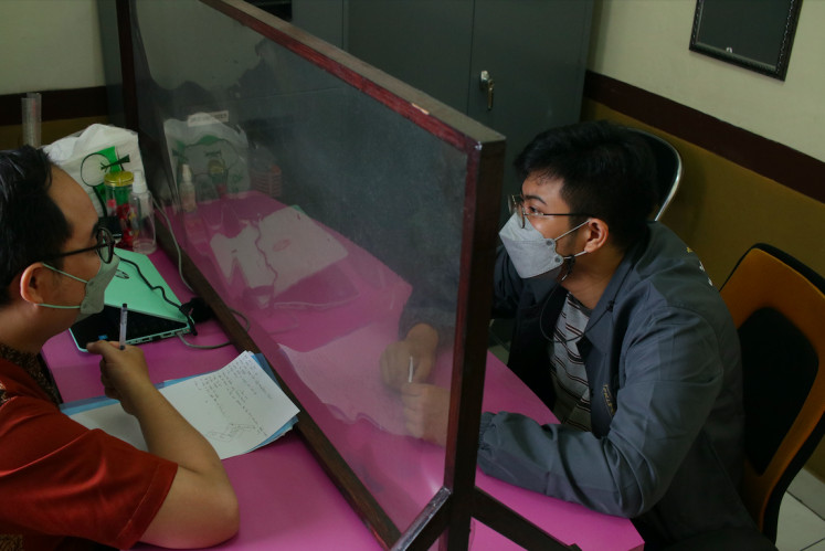 Therapy: Zefan sees a psychiatrist at a clinic in Yogyakarta on Sept. 30, 2021 to help him with his mental turbulance. (JP/Taufan Wijaya)