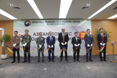 The ribbon is cut at a ceremony at the ASEAN-South Korea Financial Cooperation Centre on April 13, 2022. 