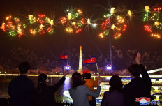Civilian show: A fireworks display lights up the sky over the Taedong River and Juche Tower to mark the Day of the Sun, the 110th birth anniversary of late North Korean leader Kim Il-sung, as seen in this picture taken on Friday in Pyongyang and released by North Korea's state-owned Korean Central News Agency (KCNA) on Saturday.