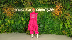 Go fuchsia: A model presents a ruffled jumpsuit accentuated with the Balinese textile 'endek' during the launch of 2Madison Avenue's seasonal collection on March 29, 2022 at the InterContinental Jakarta. (JP/Sylviana Hamdani)