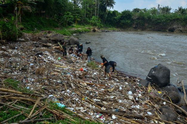Saving the river: Activists grouped under the Ecological Observation and Wetland Conservation (Ecoton) collect plastic waste that pollutes the Ciwulan River in the Leuwi Bilik area in Tasikmalaya, West Java, on April 2.
