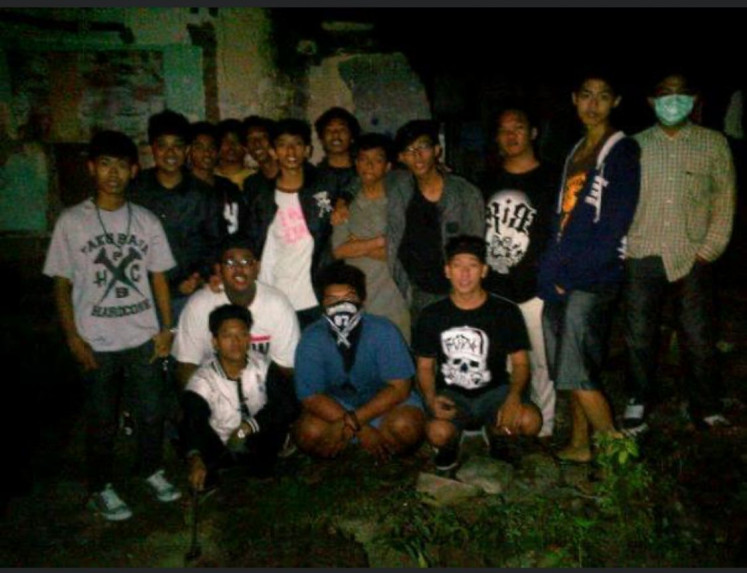Students after all: Pacul (left, white-pink shirt), a name he prefers to be called, stands together with his schoolmates for a picture in 2011. (Courtesy of Pacul)