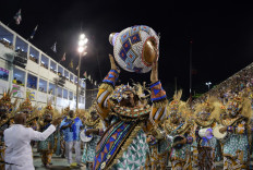 Samba's back!: A member of Portela samba school performs during the second night of Rio's Carnaval parade at the Sambadrome Marques de Sapucai in Rio de Janeiro, Brazil, on Saturday.  