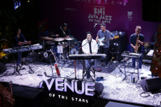 Mikha Angelo (center, on keyboard) performs on April 23 during BNI Java Jazz On The Move (JJOTM) at the Avenue of the Stars in Lippo Mall Kemang, South Jakarta.