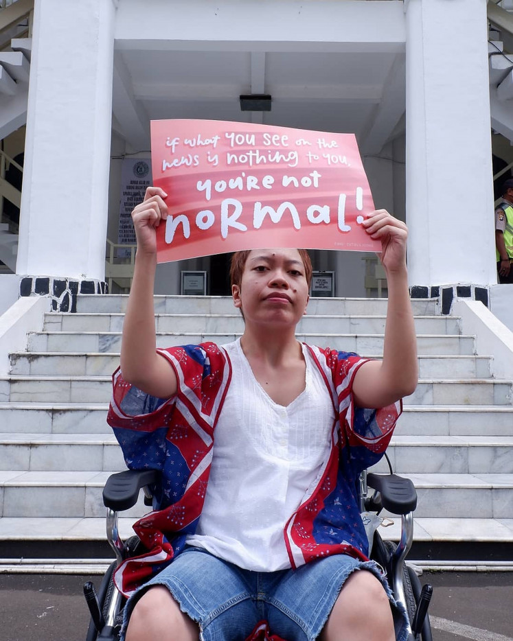 One for many: Ilma Rivai, 26, who was born with cerebral palsy, is a disability rights activist who represented women with disabilities at the Women's March rally in Jakarta. (Courtesy of Ilma Rivai/Dida Fisandra)