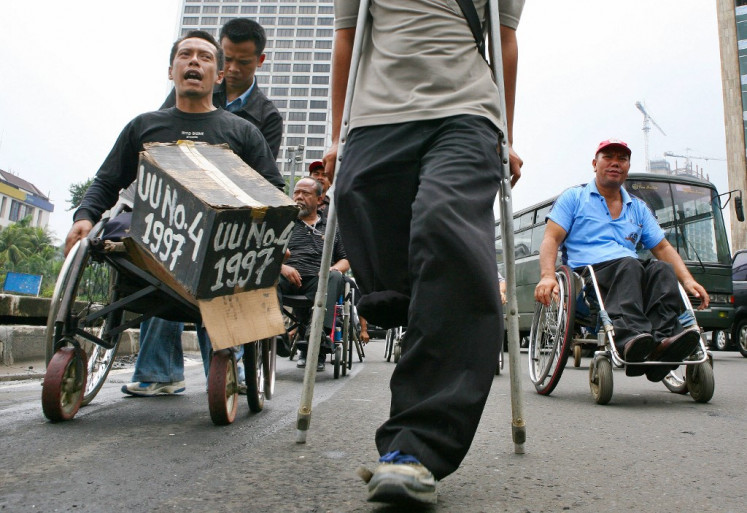 Universal rights: Disabled people demand equality during a street rally in Jakarta on Dec. 3, 2007 to mark the International Day of Disabled Persons. (AFP/Ahmad Zamroni)