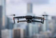In this photo illustration, a DJI Mavic 2 Pro made by the Chinese drone maker hovers in place on December 15, 2021 in Miami, Florida. Reports indicate that the world’s leading drone maker, DJI, is among eight Chinese companies expected to be placed on a US government blacklist that prohibits businesses operating in the United States from exporting technology to companies. 