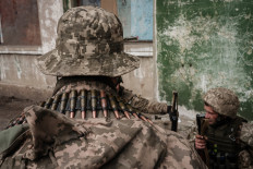 Ukrainian soldiers arrive at an abandoned building to rest and receive medical treatment after fighting on the front line for two months near Kramatorsk, eastern Ukraine on April 30, 2022. 