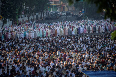 Together again: Hundreds of Muslims join the Idul Fitri congregational prayers on the morning of May 2, 2022 from the streets of Surabaya, the provincial capital of East Java.