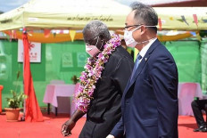 A photo taken on April 22, 2022 shows China's ambassador to the Solomon Islands Li Ming (right), and Solomons Prime Pinister Manasseh Sogavare (left) attending the opening ceremony of a China-funded national stadium complex in Honiara. 