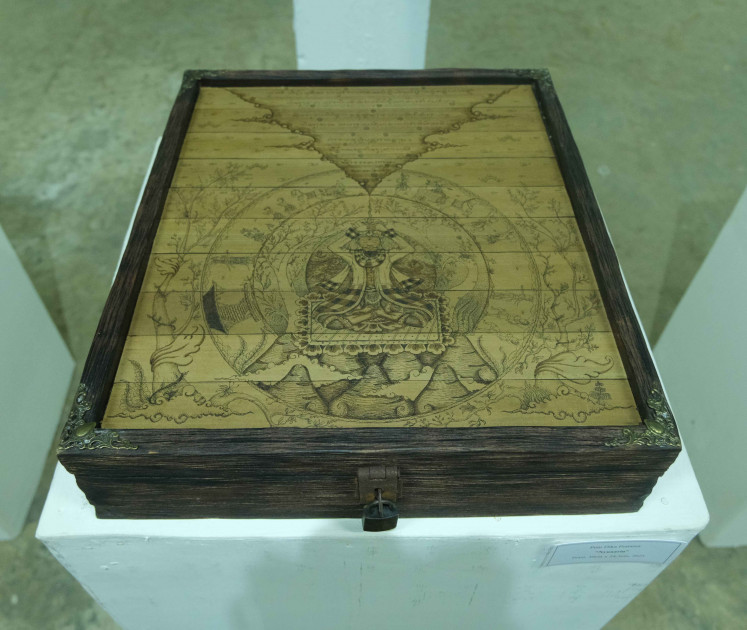 The Locked Chest: 'Sang Patih' 2021 by Putu Dika Pratama.  Prasi & wooden chest 30x34.5cm.  (Courtesy of Vincent Chandras).