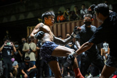 Fight club, Thai-style: Amateur combatants compete in Muay Thai on April 16 at a parking lot in the Klong Toey district of Bangkok.