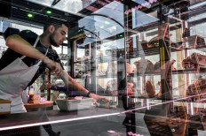 A man prepares his butcher’s shop in the culinary village of the new Cité Internationale de la Gastronomie et du Vin, on May 5, 2022 in Dijon.