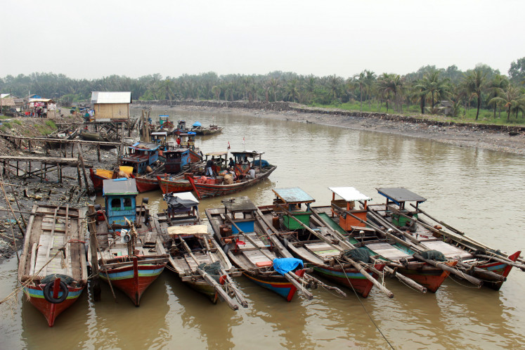 Fishing boats are seen berthed at a dock in Belawan estuary in North Sumatra in this file photo
