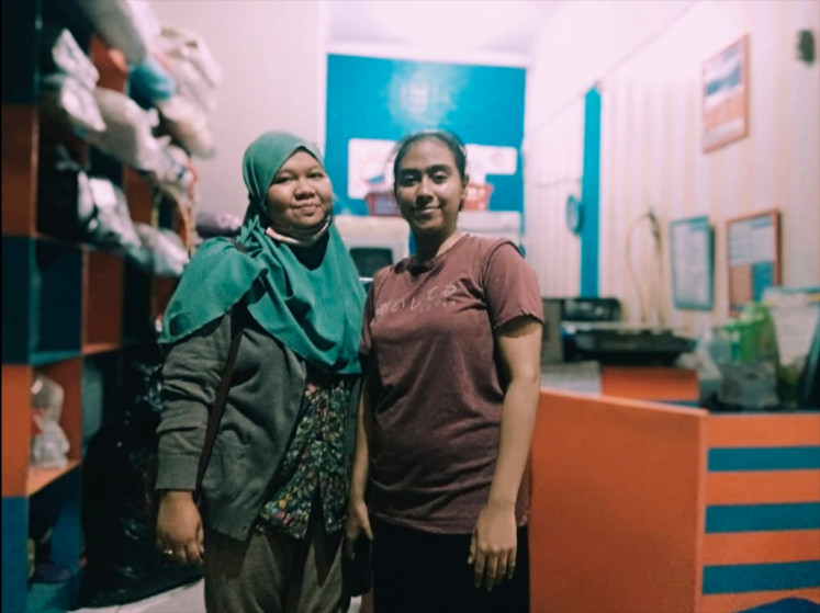 The workers: Despite initial communication hurdles, Bella and Bunga were hired as the employees of Baby Laundry, now known as Shankara Laundry. (JP/Courtesy of Shankara Laundry)