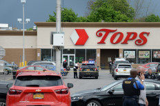 Buffalo Police on scene at a Tops Friendly Market on May 14, 2022 in Buffalo, New York. According to reports, at least 10 people were killed after a mass shooting at the store with the shooter in police custody.