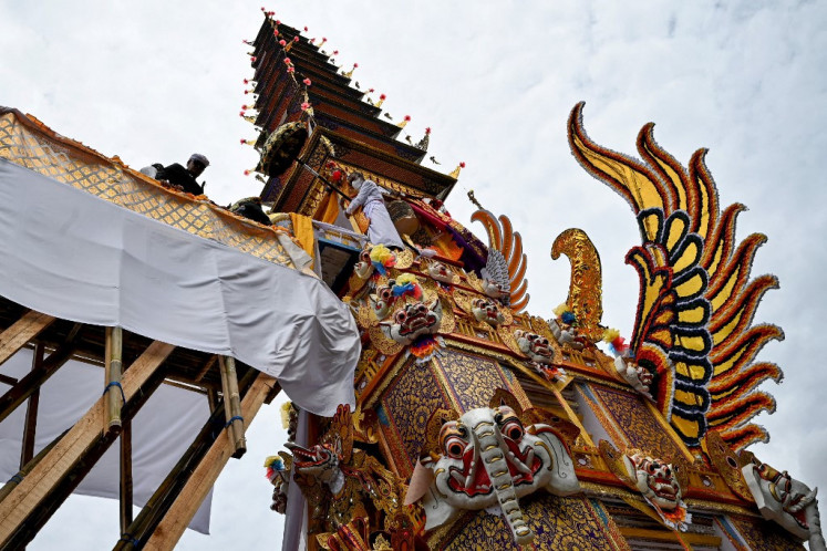 Grandeur: The triwangsa (three top castes of Balinese society) are vaunted in Balinese society and oft-associated with lavish ceremonies--such as the funeral of King Ida Cokorda Pemecutan XI of Bali, in January. (AFP/Sonny Tumbelaka)