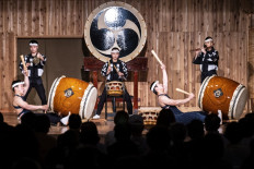 Power and sound: Performers of Kodo, including Hana Ogawa (center), perform on May 7 on Sado Island in western Japan.