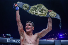 Joseph Lasiri lifts the ONE strawweight Muay Thai world championship belt after defeating then champion Prajanchai PK.Saenchai in the co-main event of ONE 157 on May 20.