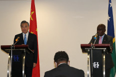 Chinese Foreign Minister Wang Yi (left) and his counterpart Solomon Islands' Jeremiah Manele (right) attend a press conference in Honiara on May 26, 2022. China has 