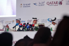 Akbar al-Baker (C), Qatar's Tourism Minister and CEO of Qatar Airways, gives a press conference regarding preparations for the Qatar 2022 FIFA World Cup, in the capital Doha on May 26, 2022.