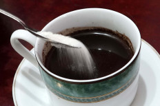 Sugar and a cup of coffee 