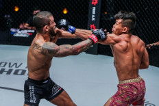 Adrein Mattheis (right) throws a punch at Alex Silva at a ONE: LIGHTS OUT mixed martial arts (MMA) match on March 11.