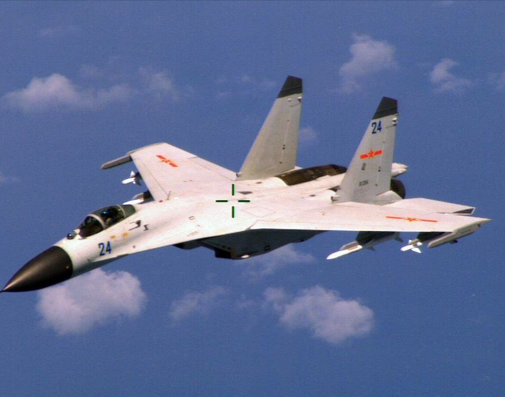This image obtained August 22, 2014, courtesy of the Department of Defense shows a Chinese fighter jet in a photo taken by a US Navy P-8 crew. 