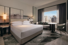 Airy space: The King Premium City View room, as with all of the 12 room types at the Hilton Singapore Orchard, features a minimalistic sofa and a marble-topped table for working and dining. (Courtesy of Hilton Singapore Orchard)