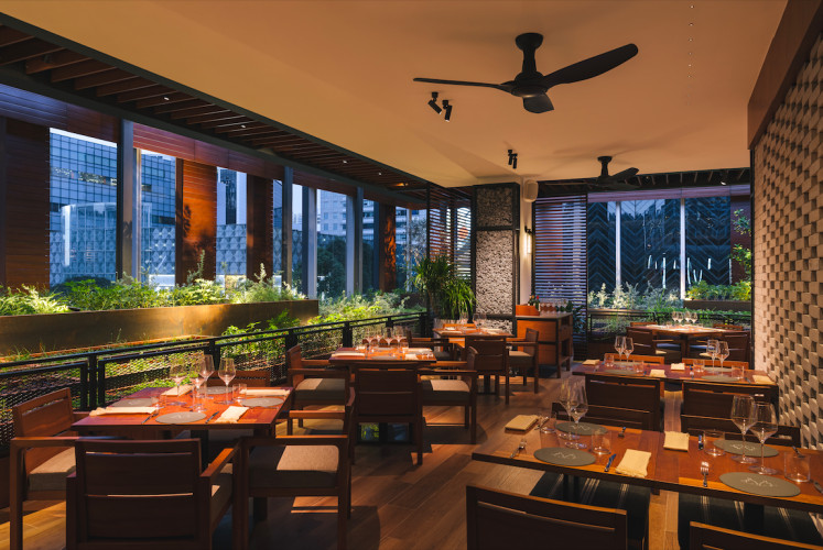 Alfresco dining: Osteria Mozza at the Hilton Singapore Orchard features outdoor balcony seating, surrounded by a garden full of herbs. (Courtesy of Hilton Singapore Orchard)