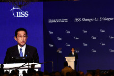 Japan`s Prime Minister Fumio Kishida delivers a keynote address at the Shangri-La Dialogue summit in Singapore on June 10.