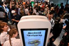 ‘New’ Moscow: Visitors use touchscreens to order their meals on Sunday at Vkusno i tochka, the Russian version of a former McDonald's restaurant, following the new chain’s opening ceremony in Moscow.