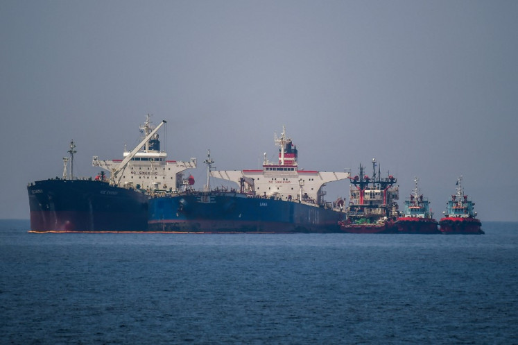 The Liberian-flagged oil tanker Ice Energy (left) transfers crude oil from the Russian-flagged oil tanker Lana (right) (former Pegas), off the shore of Karystos, on the Island of Evia, on May 29, 2022. Greece will send Iranian oil from a seized Russian-flagged tanker to the United States at the request of the US judiciary, Greek port police said Wednesday, a decision that angered Tehran. Last month the Greek authorities seized the Pegas, which was said to have been heading to the Marmara terminal in Turkey. The authorities seized the ship in accordance with EU sanctions introduced after Russia invaded Ukraine in February.