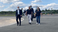 Chairman of Zhejiang Huayou Cobalt Company Limited (Huayou) Chen Xuehua (far left) and CEO of PT Vale Indonesia Febriany Eddy (far right) on a runway in Kolaka, Central Sulawesi after travel on a private jet.