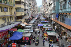 People walk through a street market in Hong Kong, China, on May 3, 2022.