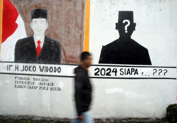 Leader in waiting: A man walks past a mural on the 2024 presidential election in Kedung Halang, Bogor, West Java, on June 13, 2022. The country will hold simultaneous legislative and presidential elections on Feb. 14, 2024.