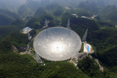 The Five-hundred-metre Aperture Spherical Radio Telescope (FAST) is seen on its first day of operation in Pingtang, in southwestern China's Guizhou province on September 25, 2016. The world's largest radio telescope began operating in southwestern China on September 25, a project which Beijing says will help humanity search for alien life.