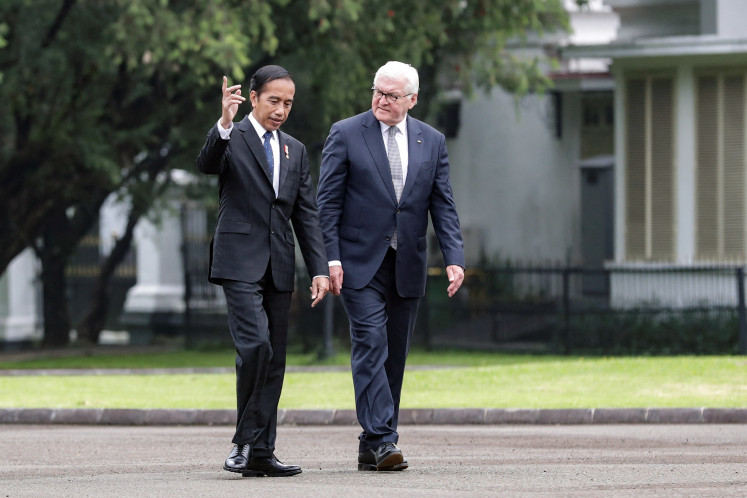Then Indonesian President Joko Widodo talks as Germany's President Frank-Walter Steinmeier listens during their meeting at the Presidential Palace, in Bogor, Indonesia, June 16, 2022. 