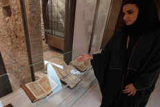 Saudi tour guide Nada Alfuraih walks inside an 18th-century palace, the very site where the kingdom's royal family is said to have first plotted its conquest of the Arabian Peninsula, in the historic district of Diriyah on May 25, 2022.