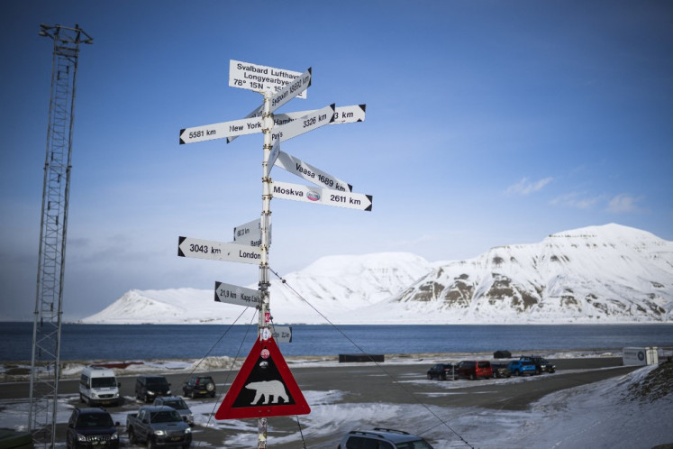 Endangered species: A triangular warning sign depicting a polar bear stands at the side of a road outside Svalbard Airport in Longyearbyen on the Svalbard archipelago in northern Norway, as seen on May 2, 2022.