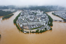  Hundreds of thousands evacuated in China after heaviest rains in decades 